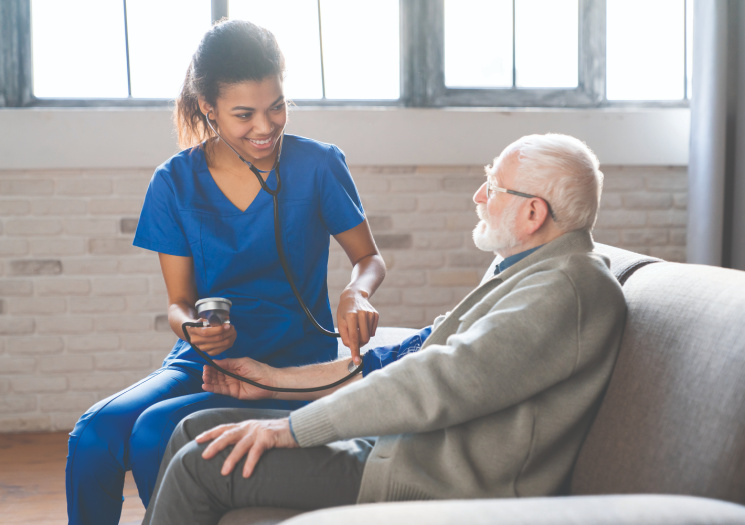 Nurse Aide with Patient