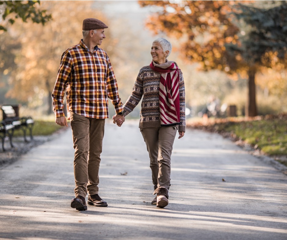 Happy senior couple waking in park near The Lafayette