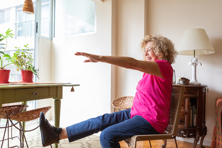 Senior woman doing chair exercise