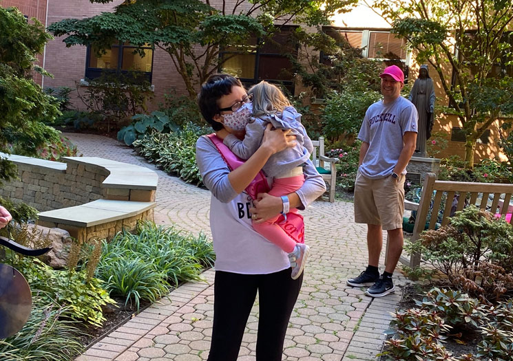 Stefanie hugging her daughter