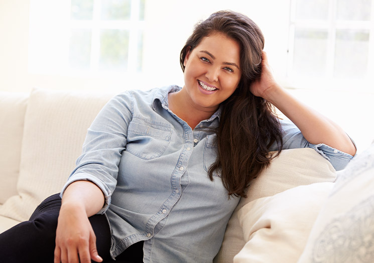 Woman sitting on couch