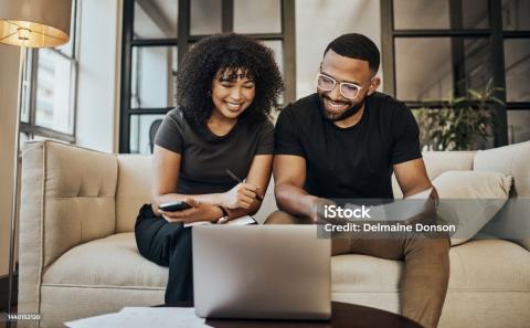 woman and man looking at computer