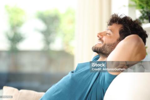 man enjoying rest on the sofa